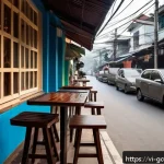 세계적인 커피 문화 비교 - A cozy Vietnamese street-side caf&eacute; scene in the early morning, featuring a traditional phin filter b...